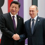 Russian President Vladimir Putin shakes hands with Chinese President Xi Jinping at a summit in Ufa, Russia. (AP Photo/Ivan Sekretarev)