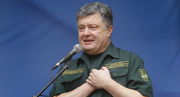 Ukrainian President Petro Poroshenko delivers his speech during his visit to the Ilich Iron and Steel Works in the southern coastal town of Mariupol, Ukraine, Monday, Sept. 8, 2014. Poroshenko made a surprise trip Monday to a key city in southeastern Ukraine as a cease-fire between Russian-backed rebels and Ukrainian troops appeared to be largely holding. (AP Photo/(AP Photo/Sergei Grits)