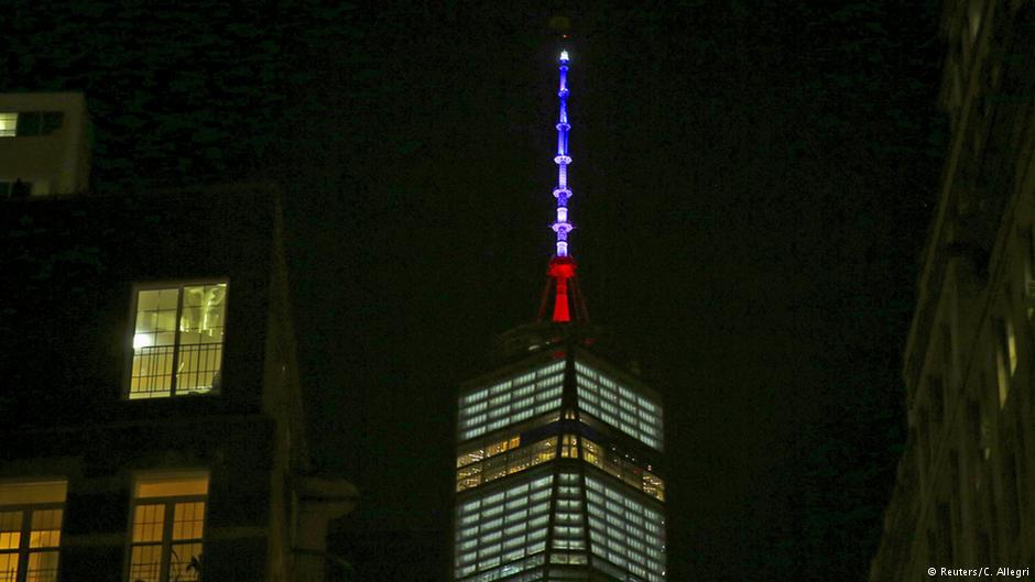 In honor of the victims in Paris the peak of the One World Trade Center shines in the colors of France