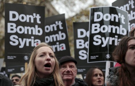 Demonstrators chant at a rally against taking military action against Islamic State in Syria, held outside Downing Street in London, November 28, 2015.