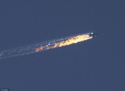 This image shows the moment the Russian Sukhoi Su-24 jet was shot down by Turkish F-16 fighter plane