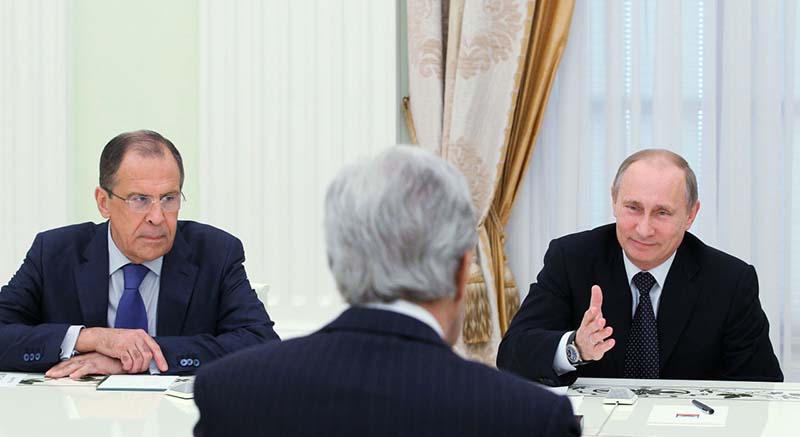 Russia's President Vladimir Putin (R) and Foreign Minister Sergei Lavrov  (L) hold talks with US Secretary of State John Kerry (C)  in the Kremlin in Moscow, on May 7, 2013. Kerry sought today to narrow differences over the conflict in Syria with Putin, urging the Russian strongman to find common ground to help end the bloodshed.  AFP PHOTO/ RIA-NOVOSTI/ POOL / MIKHAIL KLIMENTYEV        (Photo credit should read MIKHAIL KLIMENTYEV/AFP/Getty Images)