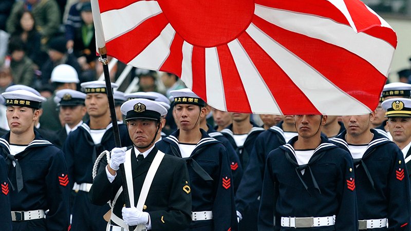 Troops of the Maritime Self-Defense Force attend an inspection parade at the Asaka base in suburban Tokyo on October 24, 2010. Around 3,800 personnel, 240 armored vehicles and 60 aircraft participated in the inspection parade.    AFP PHOTO/Kazuhiro NOGI (Photo credit should read KAZUHIRO NOGI/AFP/Getty Images)