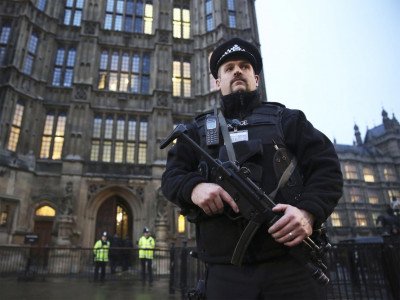 An armed British Police officer outside the Houses of Parliament Reuters