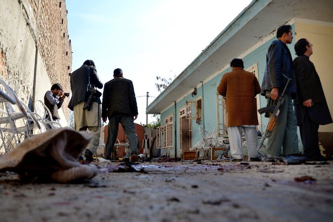 Afghan security personnel outside the house in Jalalabad that was targeted by a suicide bomber on Sunday morning. Credit Mohammad Anwar Danishyar/Associated Press