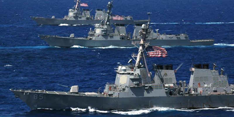 Three US Arleigh Burke Class DDGs on maneuvers in the Pacific.