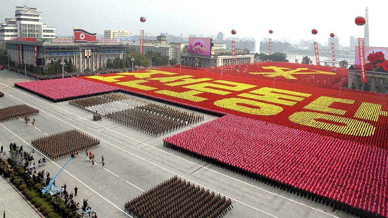 A view of a parade to commemorate the 65th anniversary of the founding of the Workers' Party of Korea in Pyongyang in this October 10, 2010 file photo.  North Korean leader Kim Jong-il died on a train trip, state television reported on December 19, 2011 sparking immediate concern over who is in control of the reclusive state and its nuclear programme. A tearful announcer dressed in black said the 69-year old had died on December 17, 2011 of physical and mental over-work on his way to give "field guidance".    REUTERS/KCNA/Files (NORTH KOREA - Tags: POLITICS MILITARY ANNIVERSARY OBITUARY) NO THIRD PARTY SALES. NOT FOR USE BY REUTERS THIRD PARTY DISTRIBUTORS