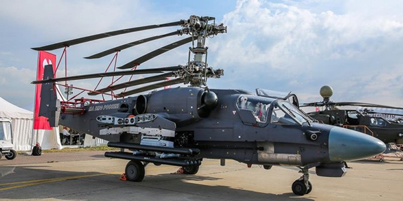 Ka-52k exhibiting stowability aboard ship with wings and rotors folded