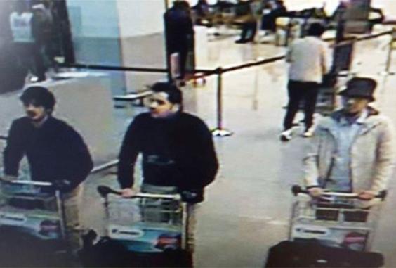 Airport CCTV shows the suspects, including the suspected third attacker, right (Belgian Federal Police ) 