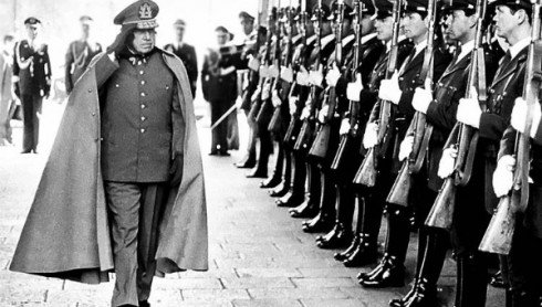 Former Chilean dictator General Augusto Pinochet reviews troops as he enters La Moneda Palace in the capital Santiago. | Photo: Reuters