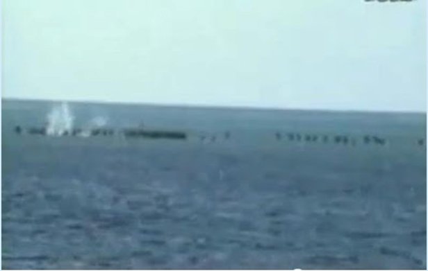 Still image from video shot from the Chinese frigate Nanchong showing Vietnamese troops being gunned down while standing on Johnson South Reef