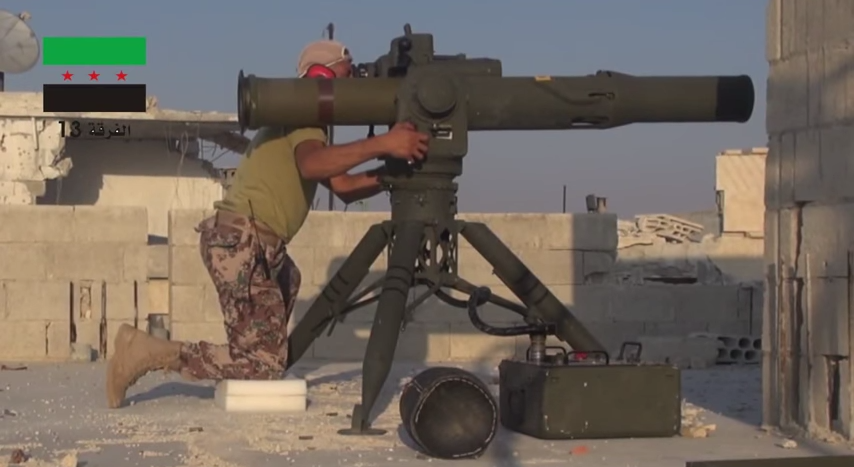 A Free Syrian Army 13th Division militant firing a BGM-71 TOW at a Syrian Arab Army target in Homs, Syria.