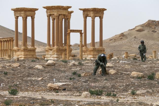 Russian army sappers work at the historic part of Palmyra, Syria, in this handout photo released by Russian Ministry of Defence on April 9, 2016.  REUTERS/Russian Ministry of Defence/Handout via Reuters
