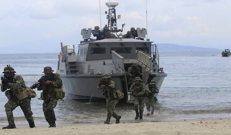Republic of the Philippines Marines practice small scale amphibious landing operations during Balikitan 2016.