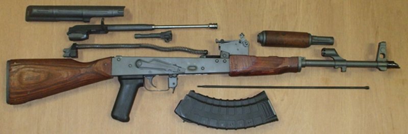 Basic field-stripping of an AK47 into six main components, as well as the magazine and cleaning rod.