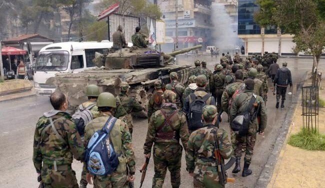 Syrian soldiers and their tank patrol the streets in Aleppo. (file photo)