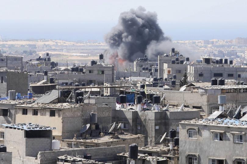 Smoke and flames are seen following what Palestinian witnesses said was an Israeli air strike in Rafah in the southern Gaza Strip July 10, 2014.