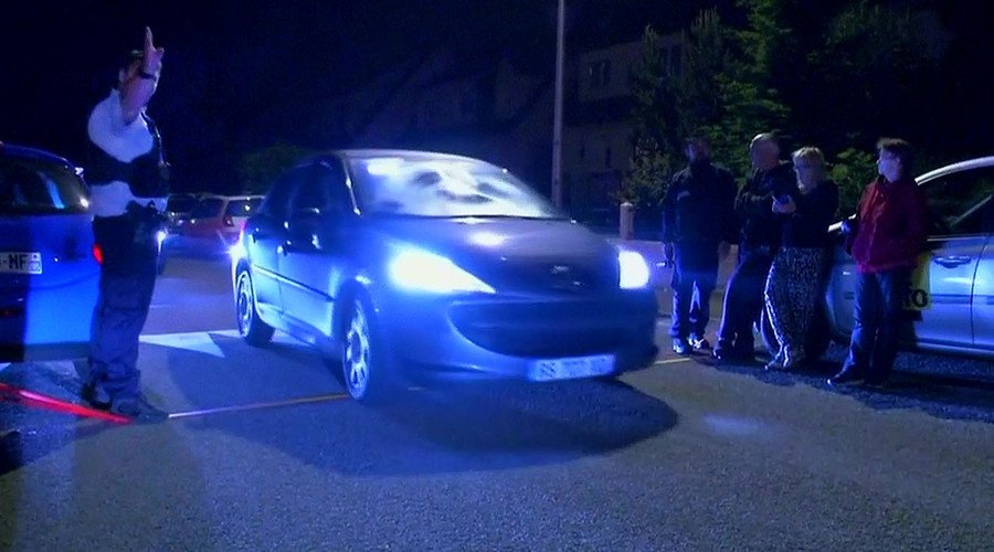 Still image taken from video shows Police vehicles at the scene near where a French police commander was stabbed to death in front of his home in the Paris suburb of Magnanville, France, June 14, 2016. © Reuters TV / Reuters