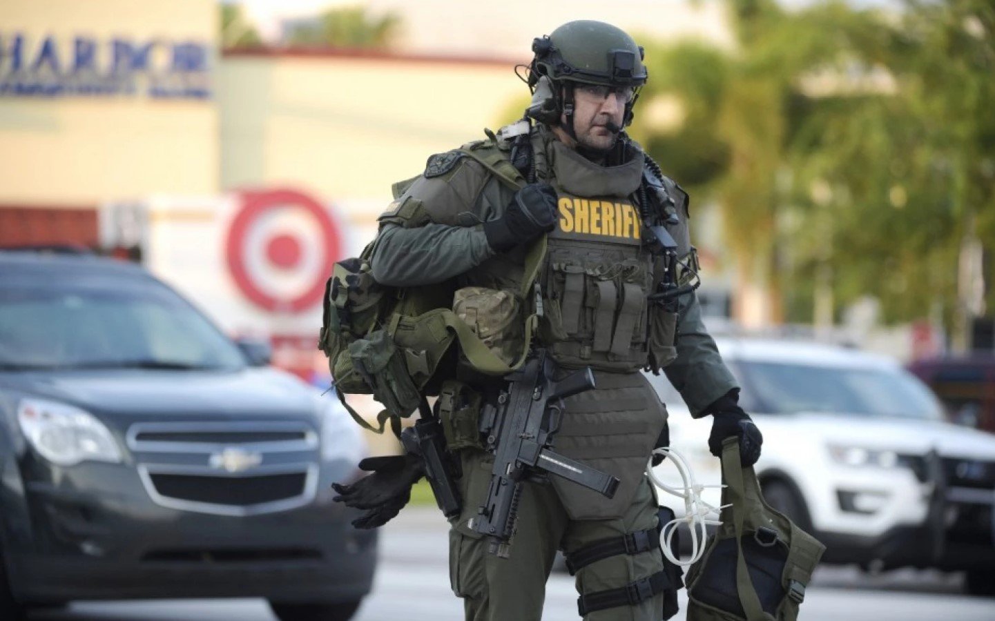 An Orange County Sheriff’s Department SWAT member arrives to the scene of a fatal shooting at Pulse nightclub in Orlando on June 12. (Phelan M. Ebenhack/AP)