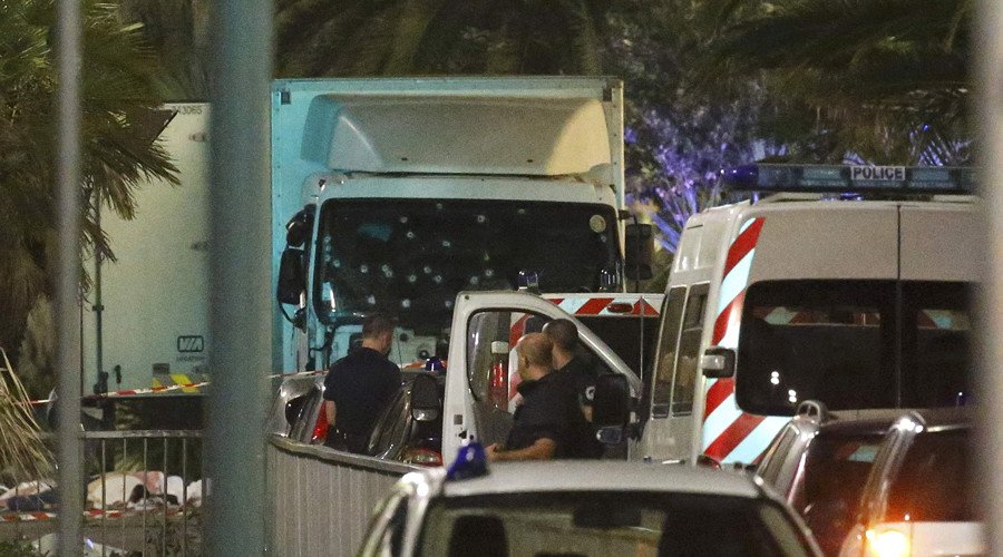 French police forces and forensic officers stand next to a truck July 15, 2016 that ran into a crowd celebrating the Bastille Day national holiday on the Promenade des Anglais killing at least 60 people in Nice, France, July 14. © Eric Gaillard / Reuters