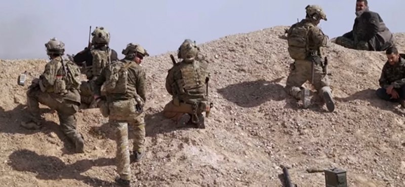 U.S. special operations personnel with Syrian Democratic Forces in combat near Manjbi, Syria.