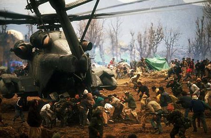 U.S. forces confronting Kurdish refugees attempting to flee to Turkey in 1991. The U.S. did not want the displaced Kurdish populations of northern Iraq to destabilize their NATO ally. Many would die at the hands of a vindictive Saddam Hussein as a result.
