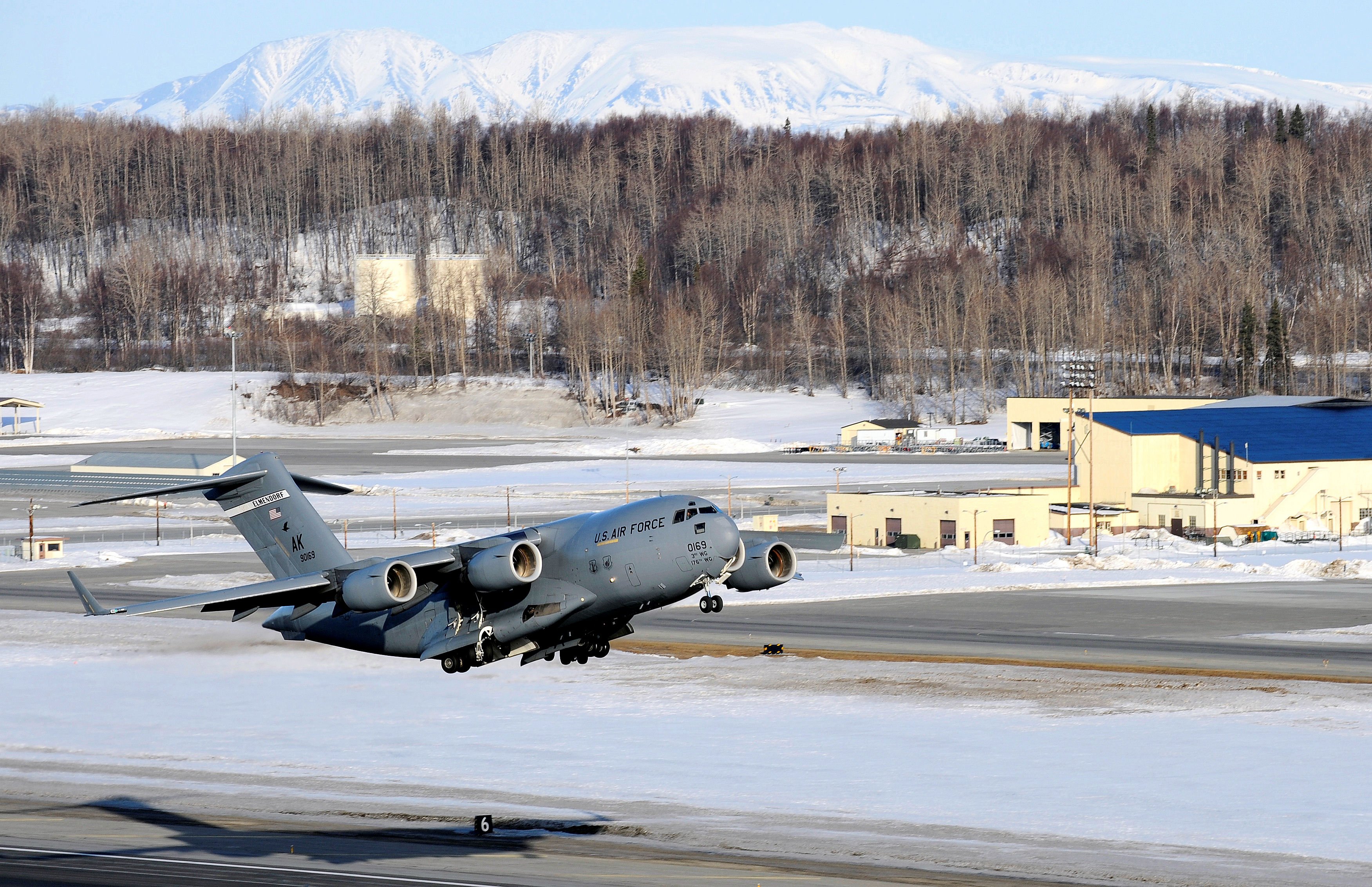 A C-17 Globemaster III takes off from Elmendorf Air Force Base March 26.  Col. Thomas Bergeson, 3rd Wing commander and F-22 Raptor pilot, was behind the controls of the aircraft for the first time. The flight included a KC-135 Stratotanker refuel, tactical arrivals and departures at Allen Army Air Field and low-level flying.  (U.S. Air Force photo/Staff. Sgt. Brian Ferguson)