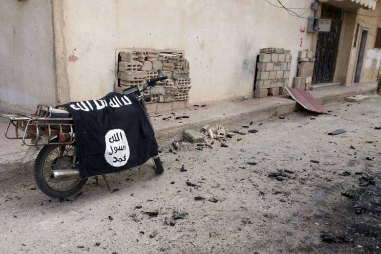 An ISIS flag on a motorbike in Palmyra in March 2016.PHOTO: REUTERS