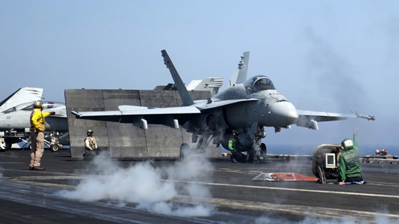 A picture released by the US Navy shows an F/A-18C Hornet assigned to the Rampagers of Strike Fighter Squadron (VFA) 83 preparing to launch from the flight deck of the aircraft carrier USS Dwight D. Eisenhower (CVN 69) on June 17, 2013 in the Mediterranean Sea. (AFP Photo/US Navy) / AFP