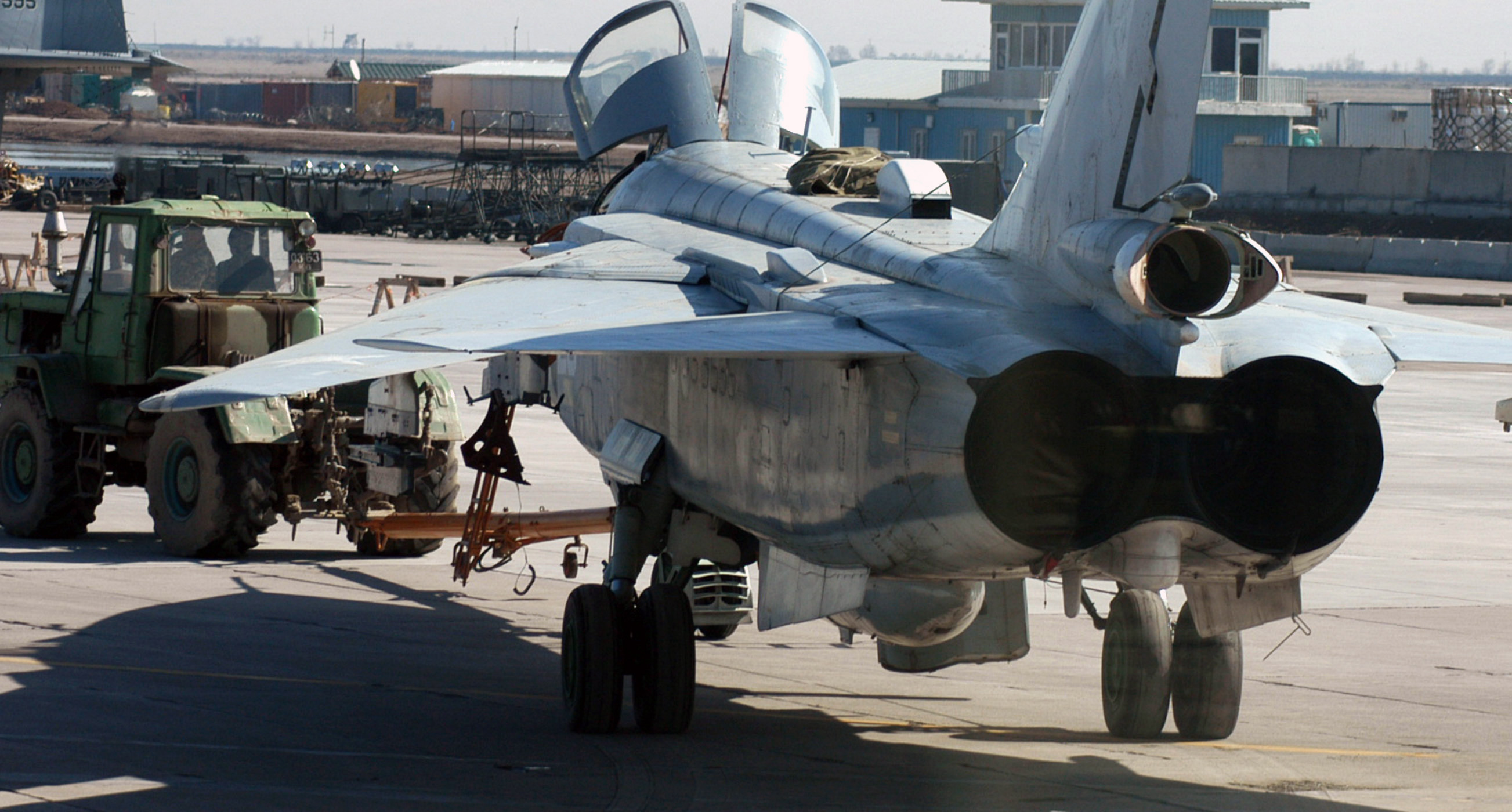 Uzbekistan Air Force maintenance personnel tow an Uzbekistan Air Force Su-24 Fencer fighter aircraft at Karshi-Khanabad Air Base, Uzbekistan, on Feb. 14, 2005, during Operation Enduring Freedom. (U.S. Air Force Photo by Tech. Sgt. Scott T. Sturkol) (Released)
