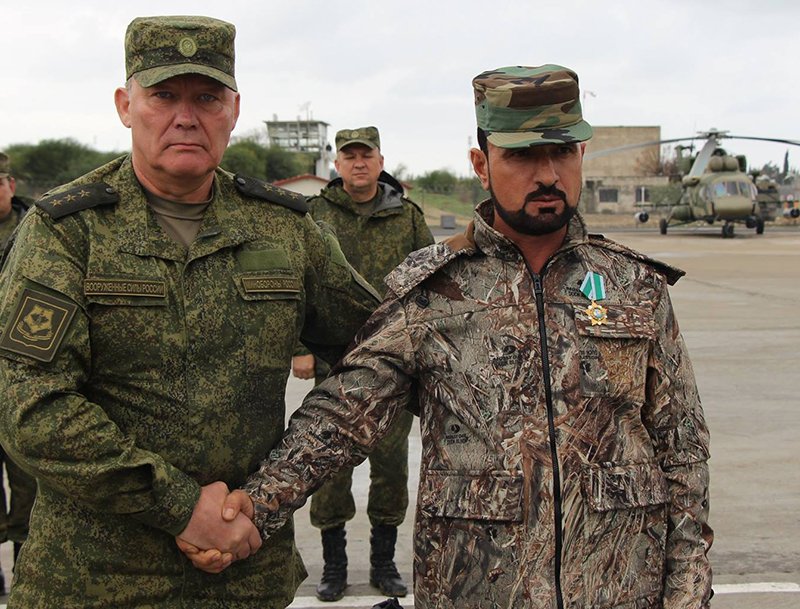 Suheil Al Hassan meets with Russian representatives at the Khmeimim Air Base in the Syrian province of Latakia