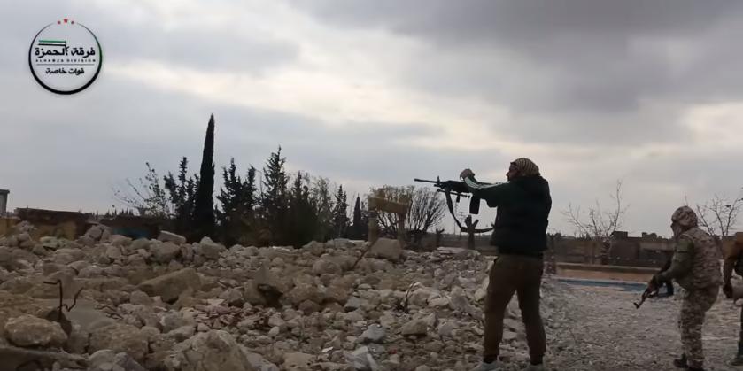 A FSA militant poses for a photo-report of the FSA's battle against ISIS"