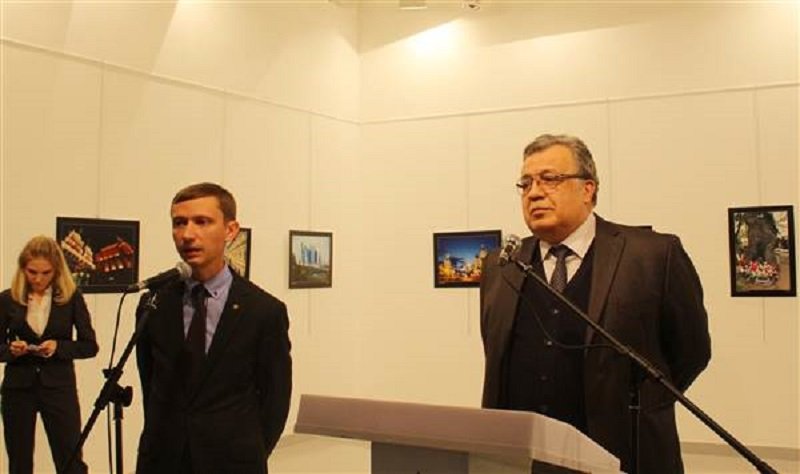 Russian Ambassador to Turkey, Andrei Karlov (R) gives a speech as he visits an art fair in Ankara, Turkey, on Dec.19, 2016. Ecenur Colak / Anadolu Agency Via Getty Images