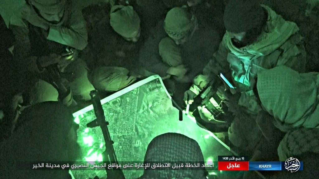ISIS militants discuss a plan of the Deir Ezzor operation