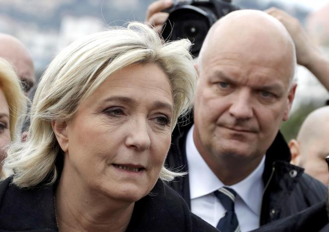 French National Front leader Marine Le Pen and presidential election candidate, walks on the Promenade des Anglais with her bodyguard Thierry Legier (R) in Nice, France February 13, 2017.    REUTERS/Eric Gaillard/File Photo