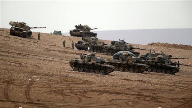 Turkish soldiers hold their positions on the outskirts of Suruc, at the Turkey-Syria border, overlooking Kobani, Syria, during fighting between Syrian Kurds and ISIL, Oct. 12, 2014.