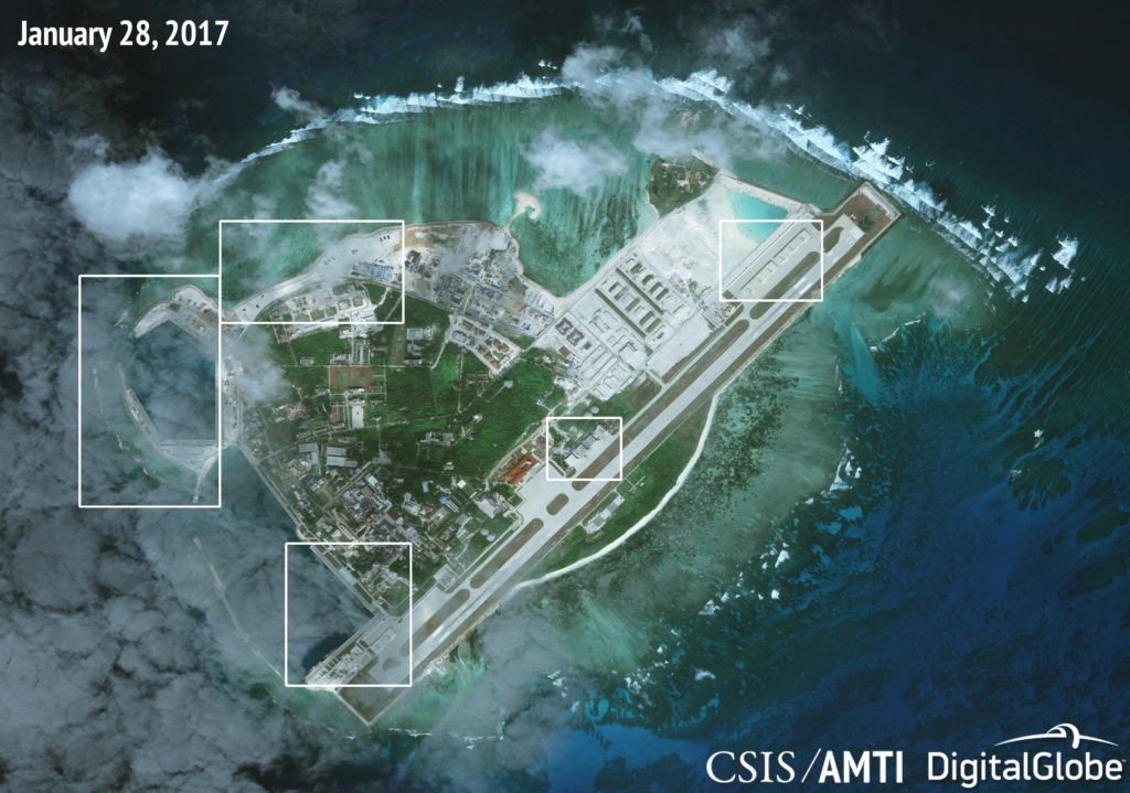 Recent satellite imagery of Woody Island clearly shows the extent of construction on the island. The port facilities in the northwest and southwest corners have been vastly improved, the HQ-9 SAM battery is still deployed on the north beach, and the strengthened aircraft hangars are completed.