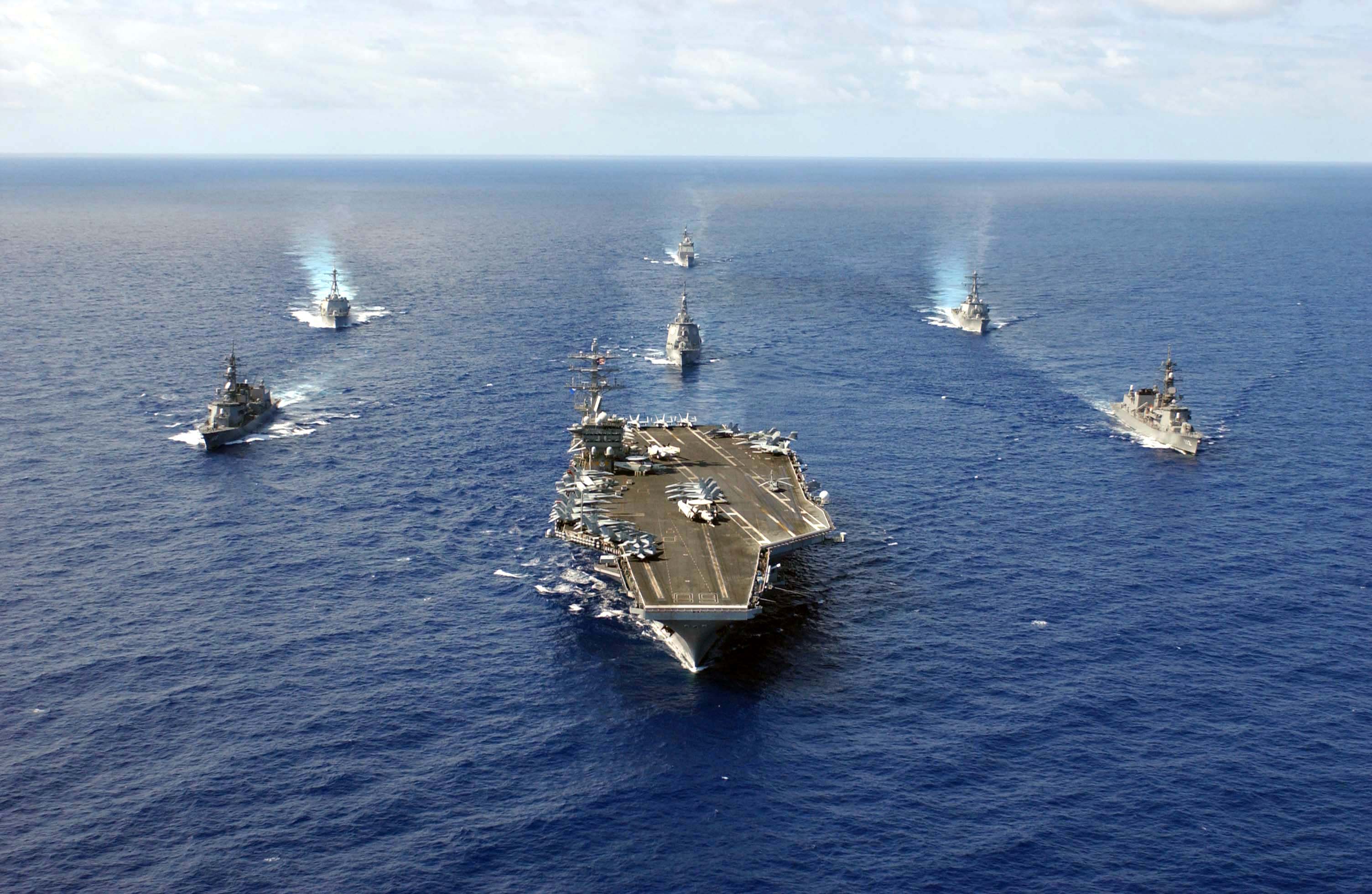 050525-N-0413R-187 Pacific Ocean (May 25, 2005) - The nuclear powered aircraft carrier USS Nimitz (CVN 68) leads ships attached to the Nimitz Strike Group and the Japan Maritime Self Defense Force (JMSDF) in formation during a photo exercise in the Pacific Ocean. The Nimitz Carrier Strike Group is currently on a regular scheduled deployment in support of the global war on terrorism. U.S. Navy photo by Photographer's Mate 3rd Class Shannon E. Renfroe (RELEASED)