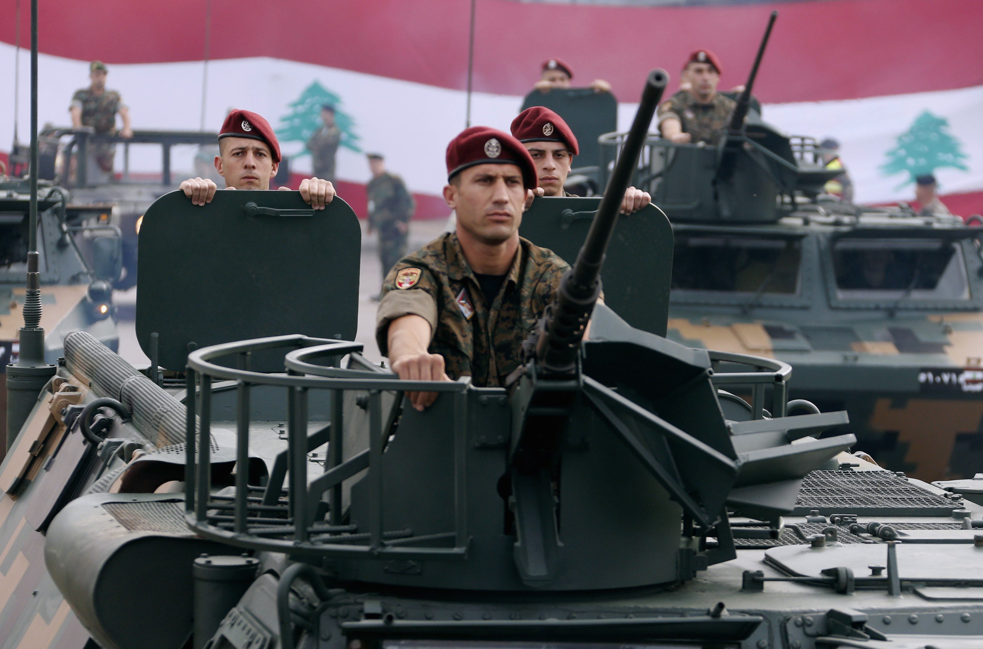 Lebanese Army soldiers on their military vehicles take part in a military parade to celebrate the 70th anniversary of Lebanon's independence, in downtown Beirut November 22, 2013. REUTERS/Mohamed Azakir (LEBANON - Tags: ANNIVERSARY POLITICS MILITARY)