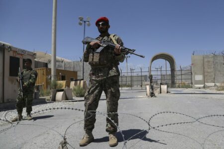 An Afghan National Army (ANA) soldier stands guard at Bagram Air Base, after the departure of all U.S. and NATO troops. ZAKERIA HASHIMI/Getty Images